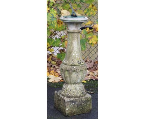 A late 19th century stone garden sundial of fluted baluster form, the 9” engraved brass dial inscribed “F. Barker &amp; Son, 