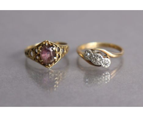 A 9ct gold cross-over ring set three tiny diamonds, size K, 2.5g; &amp; a 9ct gold ring set oval amethyst, size K, 1.5g.