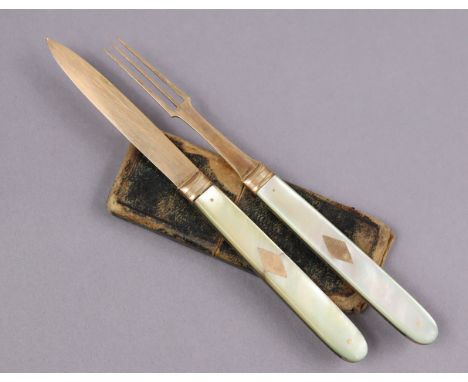 A pair of early/mid-19th century gilt metal folding pocket knife &amp; fork with mother-of-pearl sides, un-marked, in origina
