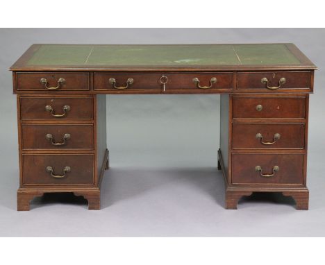 A Victorian mahogany large pedestal desk inset gilt-tooled green leather writing surface to the rectangular top, with moulded