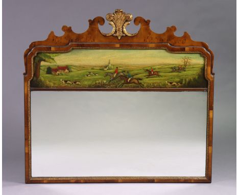 A George III style walnut, parcel gilt &amp; painted overmantel or trumeau mirror, decorated with a hunting scene above the r