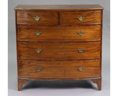 A Georgian mahogany bow-front chest fitted two-short &amp; three long graduated drawers with brass swan-neck handles, on shap