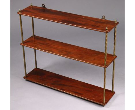 A Victorian mahogany three-tier open wall shelf on brass rope twist supports with flame finials (the supports un-screw for di