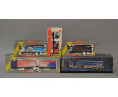 Four  boxed 1:50 scale trucks, three by Joal - Volvo Globetrotter, Daf 95XF and a Volvo FH-12 and one boxed model by Corgi - 