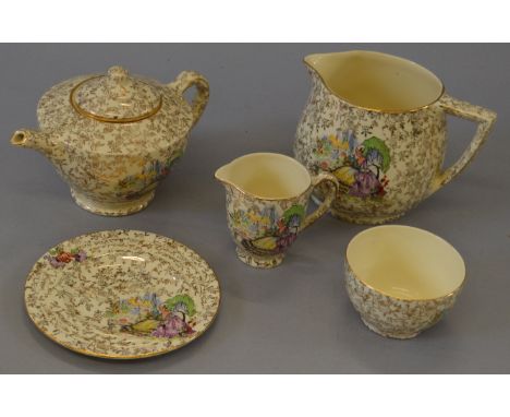 Empire Shelton ivory childs tea set (April/May 1940) featurin images of ladies in yellow crinoline dresses, including tea pot