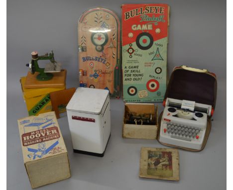 A Mettoy Playthings ' Hoover' Washing Machine F/G in G box,  a Petite Typewriter in vinyl case, two boxed childrens sewing ma