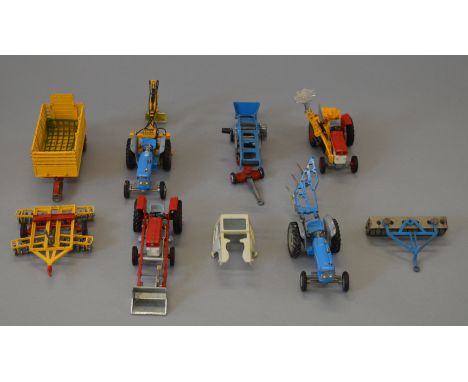 A group of unboxed agricultural diecast models and farm implements  by Corgi. This lot includes two Ford and two Massey Fergu