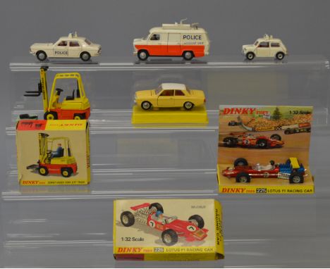 Four unboxed Dinky Toys including  three Police vehicles, a Transit (with two plastic road signs), a Mini, missing a door sti