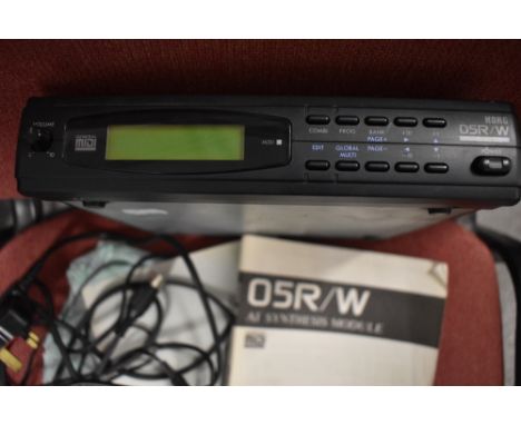 A Korg 05R/W synthesiser module, with instruction manual and power supply