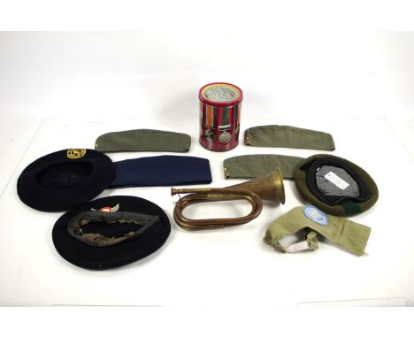 A mixed lot including headwear a bugle with Australian regiment badge etc.