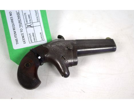 A Colt No.2 .41 R/F Cal. Derringer barrel flat marked address Col Colt Hartford Ct. U.S.A.2. Side of barrel retailer marked "