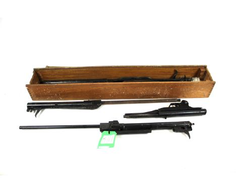 A wooden box containing various air gun spares, including two B.S.A. Meteor barrels and a Webley Hawk MKII barrel etc.NB. As 