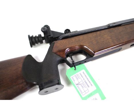 A Feinwerkbau 300s .177 Cal recoiless air rifle Ser. No. 115325 complete with original diopter target sights. A classic targe