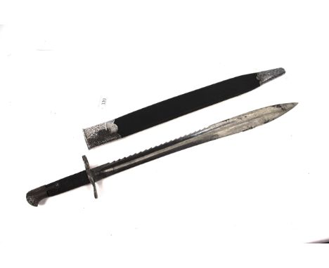 A British model 1871 Elcho bayonet with scabbard. Blade marked WD with arrow, crown, E27, also VR under crown. Blade in fair 