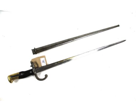 A French model 1874 epée bayonet for the Gras Rifle complete with matching numbered scabbard. Blade marked and dated 1879
