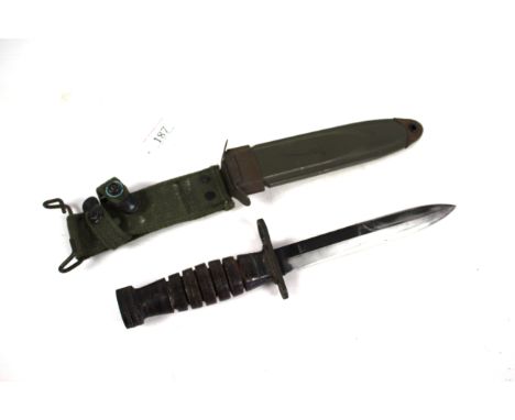 A WWII era U.S.A. M4 bayonet (by Case) for the M1 carbine. Complete with scabbard marked U.S. M8A1 PWH. a good honest example