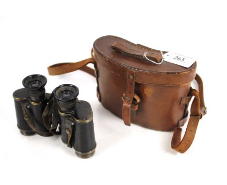 A pair of WWI era binoculars of German origin, Goerz Berlin, marked with broad arrow within original leather case