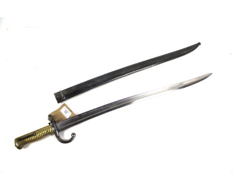 A French model 1866 sabre bayonet with brass hilt and matching numbered scabbard. A very good example 