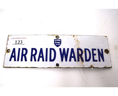 A WWII era enamel sign "Air Raid Warden", approx. 3" x 9". a fine sign that also has the Essex shield present 