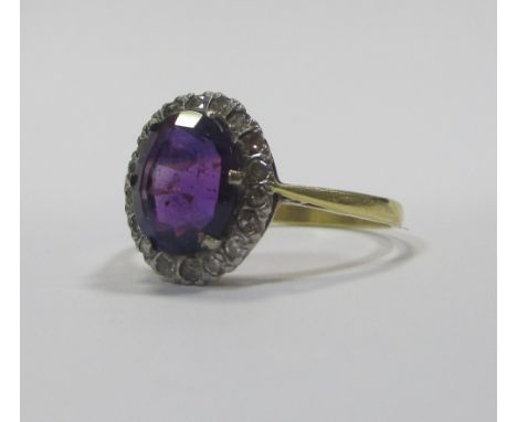 An 18ct amethyst and diamond ring, size N and a 9ct sapphire and diamond ring, size R (2)  