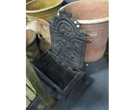 A cast iron fire grate and back  