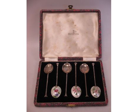 A set of six silver and enamel coffee spoons by Walker and Hall, cased  