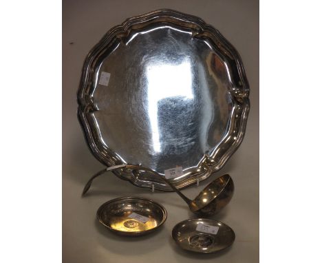 A German metalwares salver, A dutch metalwares ladle and two ashtrays (4)  