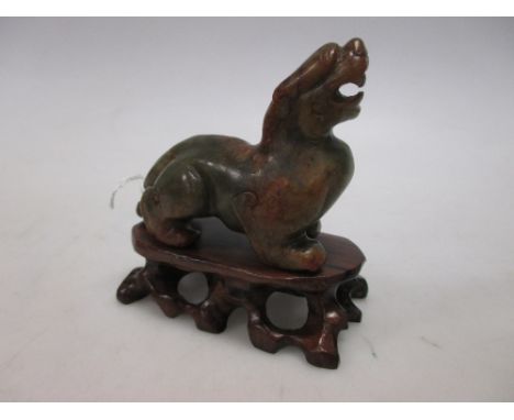 A Chinese jade figure of a bixie  