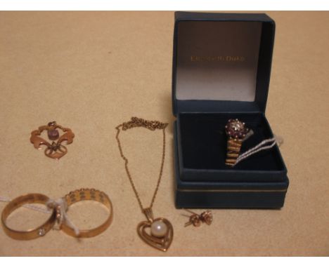 An 18ct gemset ring (4.3g), two 9ct gemset rings (5.4g), a 9ct pearl set heart shaped pendant, a 9ct pendant and a pair of wh