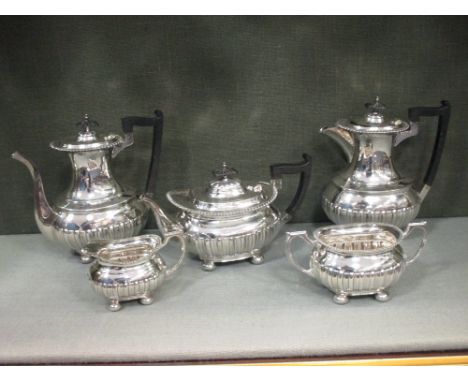 A five piece electroplate tea and coffee set by Walker and Hall  