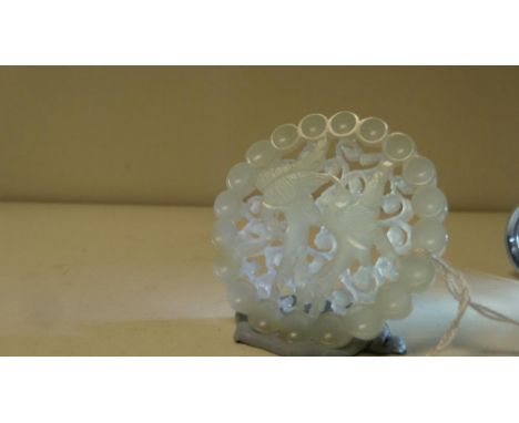 A Chinese circular pale green jade pendant, 5.5cm (2.25 in) diameter  Good