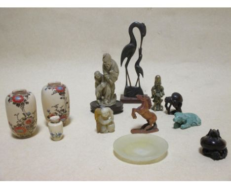 A group of netsuke, oriental animals, a stone dish and a Shoushan stone figure of a boy  