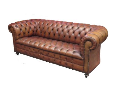 A tan leather upholstered Chesterfield sofa, 217 x 90cm  Early 20th century its an unusual brown colour and the seat leather 