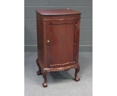 An Edwardian mahogany bow front cabinet on claw and ball feet, together with a Victorian mahogany dressing table mirror (2)  