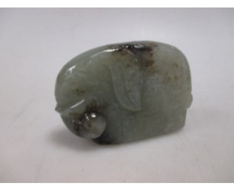 A Chinese jade pendant carved as an elephant  