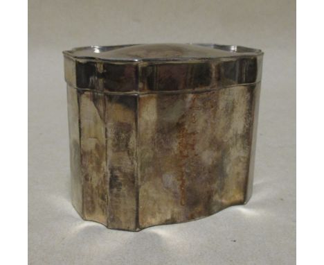 A silver tea caddy and cover  