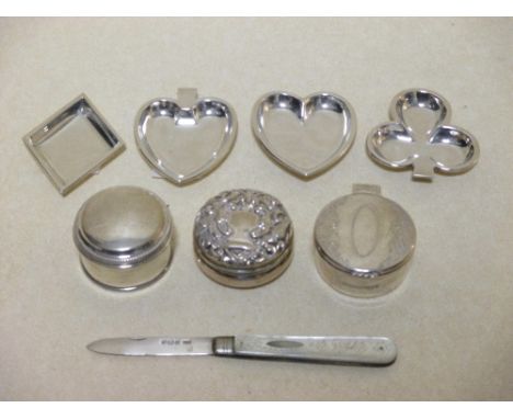 Three circular silver boxes and a set of four novelty ashtrays depicting playing card suites and a fruit knife  