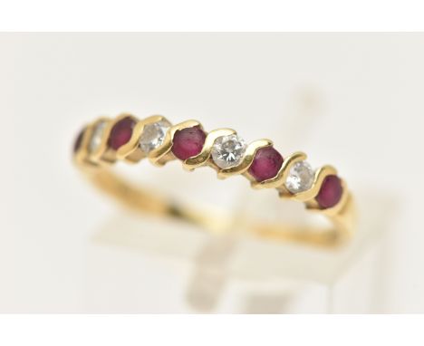 AN 18CT GOLD RUBY AND DIAMOND HALF ETERNITY RING, set with a row of five circular cut rubies interspaced with four round bril