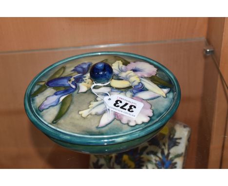 A MOORCROFT POTTERY 'ORCHID' PATTERN COVERED BOWL, tube lined with blue and purple orchids on a graduated green blue ground, 