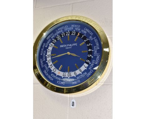 A 'DISPLAY CLOCK' printed 'Patek Philippe', with a blue printed background and Arabic numeral twenty-four hour marks, assorte