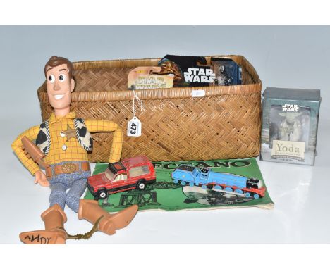 A QUANTITY OF ASSORTED TOYS, to include Mattel Hot Wheels Star Wars cars, still sealed on original backing cards, which have 