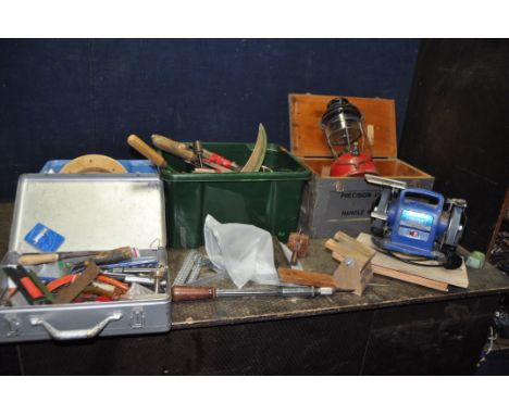 A DRAPER BENCH GRINDER AND THREE BOXES OF HAND TOOLS including files, hammers, a marking gauge, a 'Yankee', a paraffin storm 