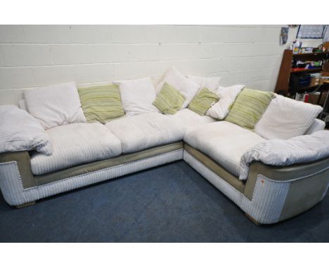 A BEIGE UPHOLSTERED JUMBO CORD CORNER SOFA, with scatter cushions, length 280cm x depth 220cm x height 87cm (condition report