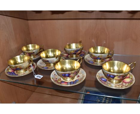 SEVEN AYNSLEY ORCHARD GOLD TEACUPS AND SAUCERS, each teacup with gilt interior, rim, handle and foot, each saucer with gilt c