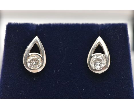 A PAIR OF 18CT WHITE GOLD DIAMOND EARRINGS, each of a pear drop open work design set with a round brilliant cut diamond, one 