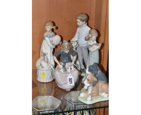 A GROUP OF FIVE LLADRO AND NAO FIGURINES to include two Lladro figures comprising 'My Loyal Friend' No. 6902 designed by Erne