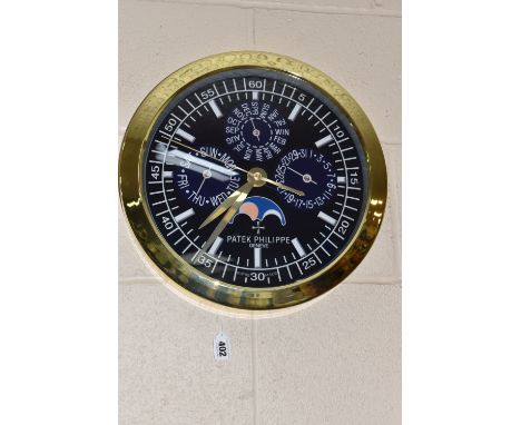 A 'DISPLAY CLOCK' printed 'Patek Philippe', with a dark blue printed background and Arabic numeral minute marks in multiples 
