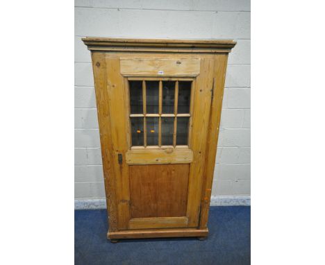 A PINE CUPBOARD, fitted with single door, that’s enclosing two glass shelves, and a wooden shelf, width 106cm x depth 55cm x 