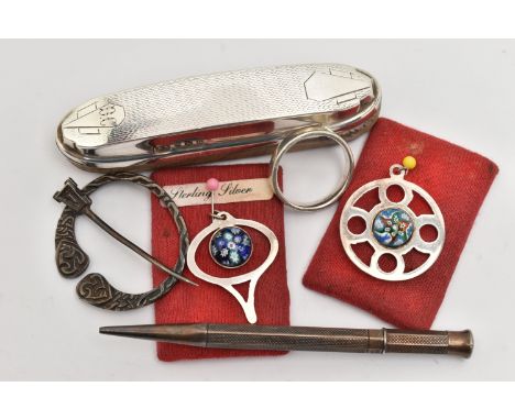 A SMALL BAG OF ASSORTED ITEMS, to include two silver millefiori cabochon set pendants, each hallmarked Edinburgh, a silver po