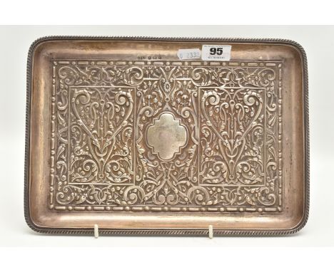 AN EARLY 20TH CENTURY SILVER EMBOSSED TRAY, of a rectangular form with embossed design, vacant cartouche to the centre and ga